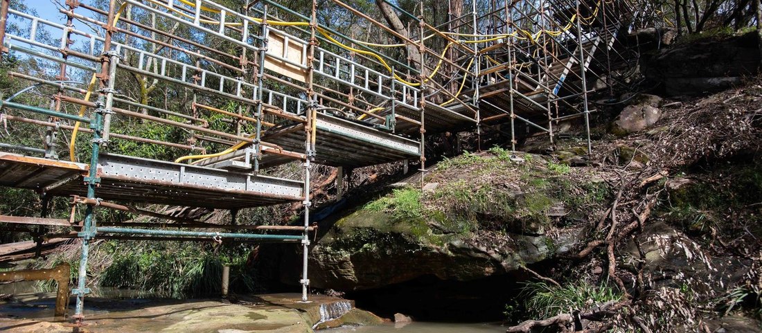 Scaffold platform built across a creek for grout curtain drilling