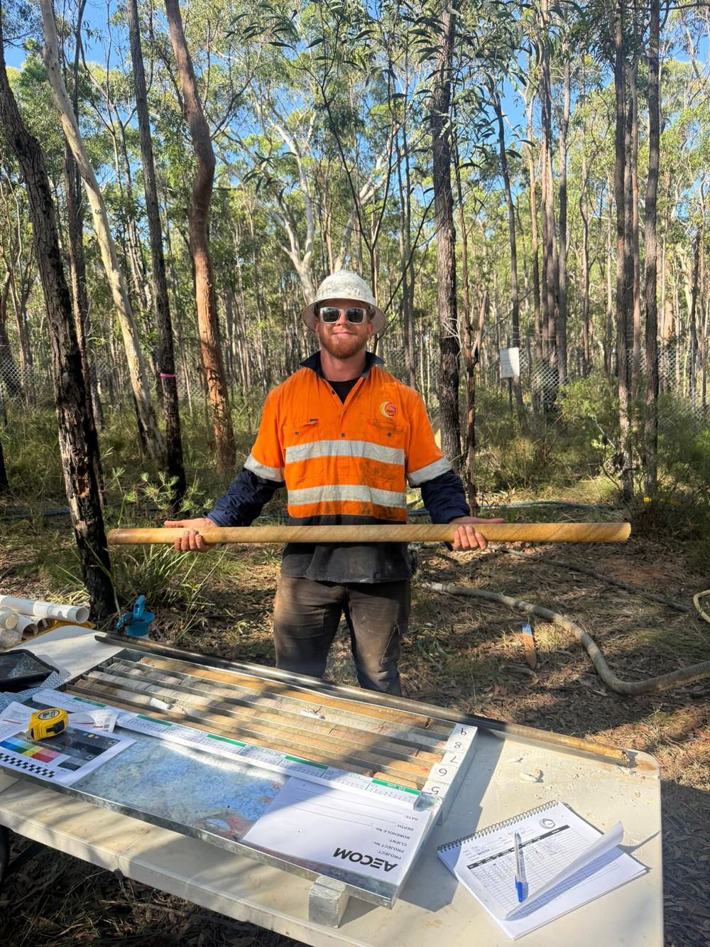 Geologist logging a core box on site