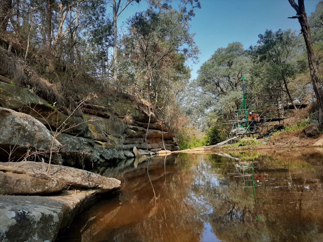 Grouting crew working on a creek rockbar
